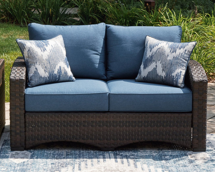 Windglow Outdoor Loveseat with Cushion - Evans Furniture (CO)