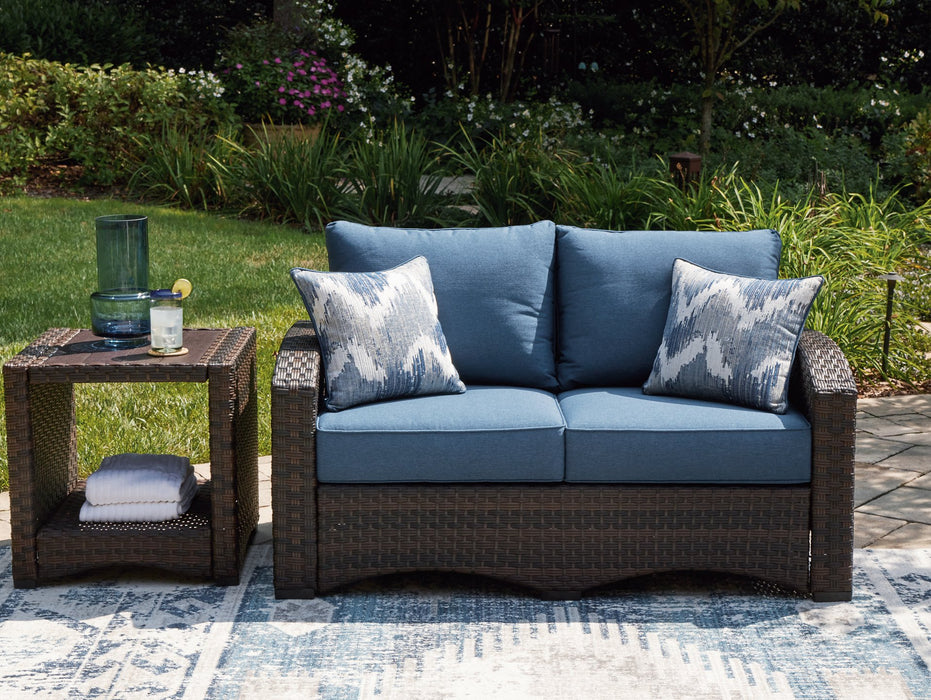 Windglow Outdoor Loveseat with Cushion - Evans Furniture (CO)