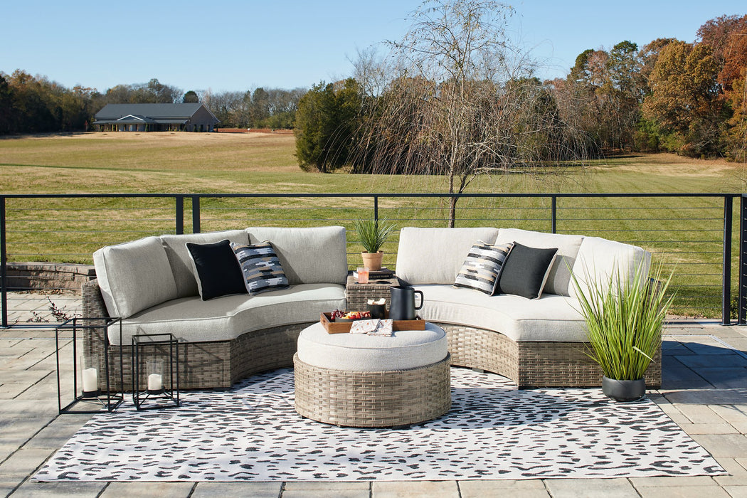 Calworth Outdoor Sectional with Ottoman - Evans Furniture (CO)